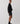 Side view of model wearing crewneck sweater [color: WASHED BLACK] 