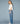Side view of model wearing cargo jeans [color: DENIM BLUE]